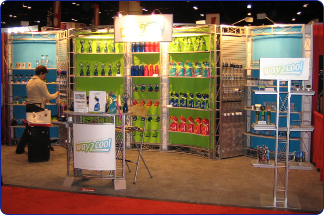 Way2Cool owns this tricked out Bayview. Using colored panels effectively, they spent very little on graphics yet made it look like it is all custom. They also went with a high-end metallic laminate, storage doors in the slatwall bases, upgraded lighting and merchandising trees.